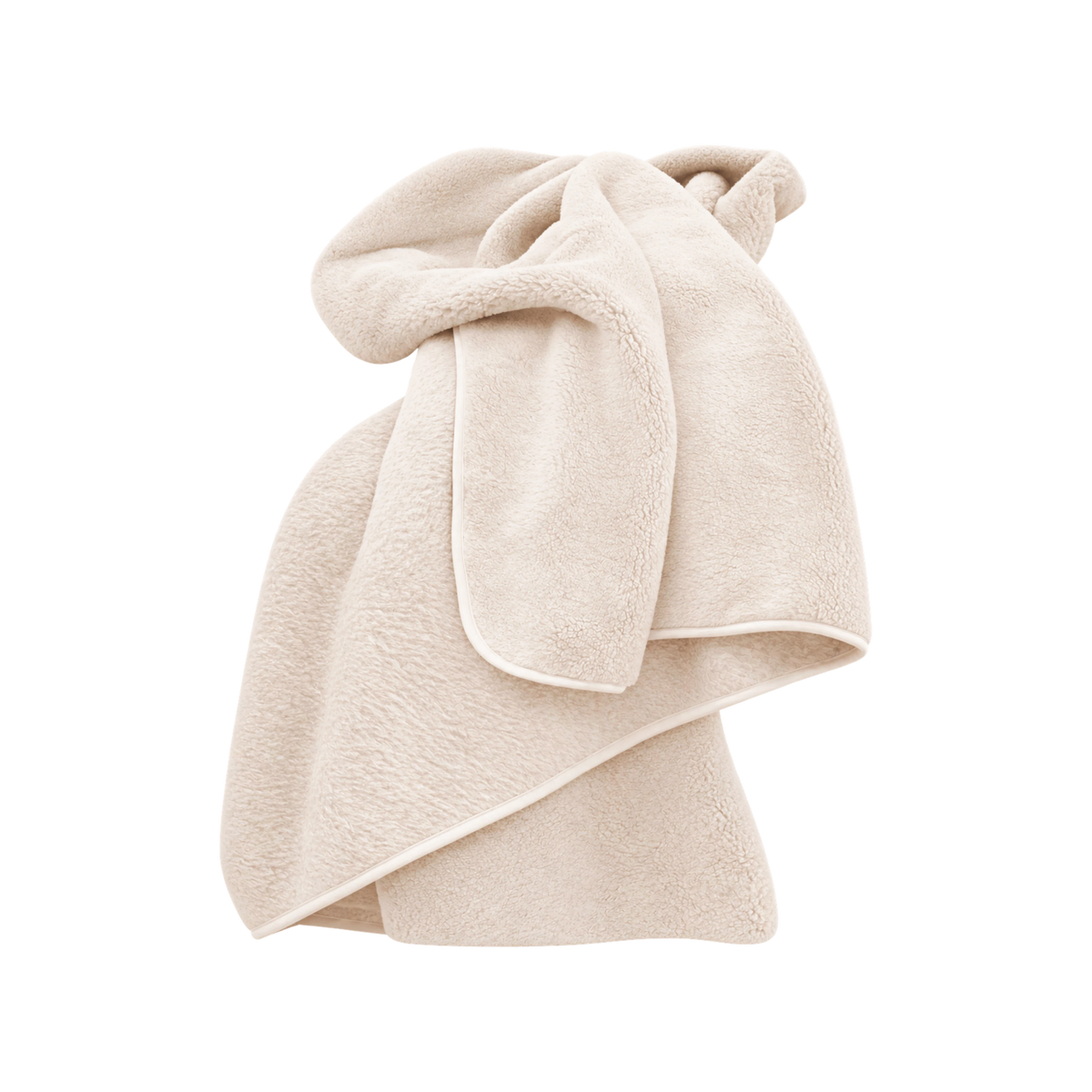 Merino Fleece Throw in Ivory, loosely draped to show its soft plush texture and piped edge detailing.