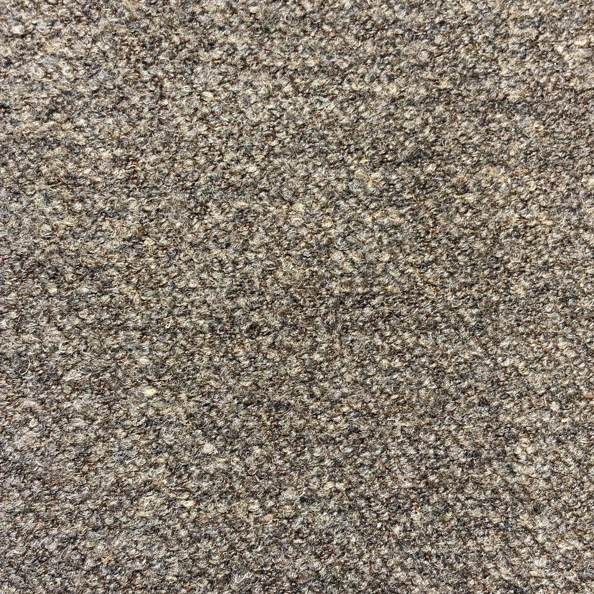 Keystone Reclining Sofa fabric detail in heathered taupe-brown, highlighting the woven, multi-tonal texture.