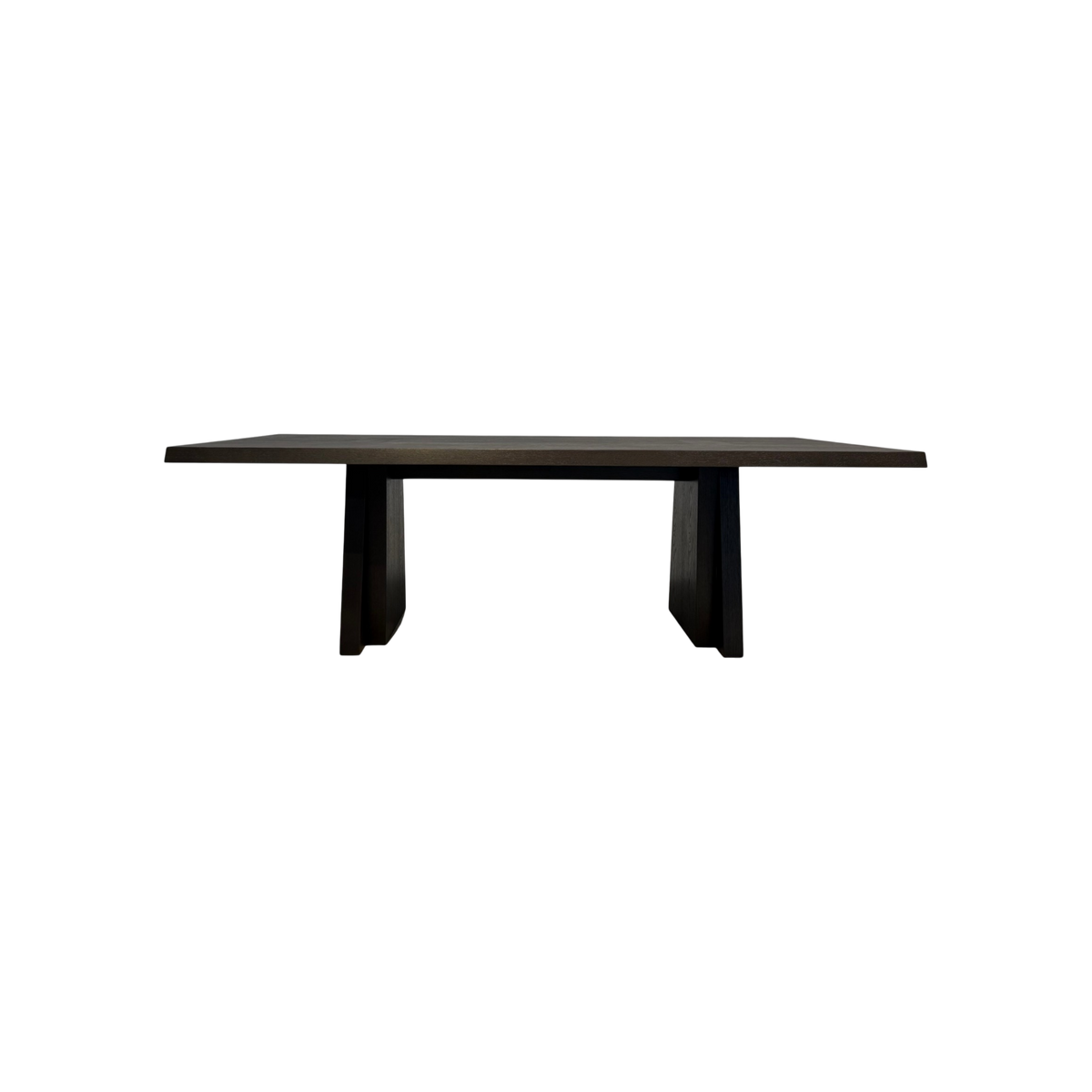 Oblique Dining Table in dark wood with a long rectangular top and two angular trapezoidal pedestal bases.