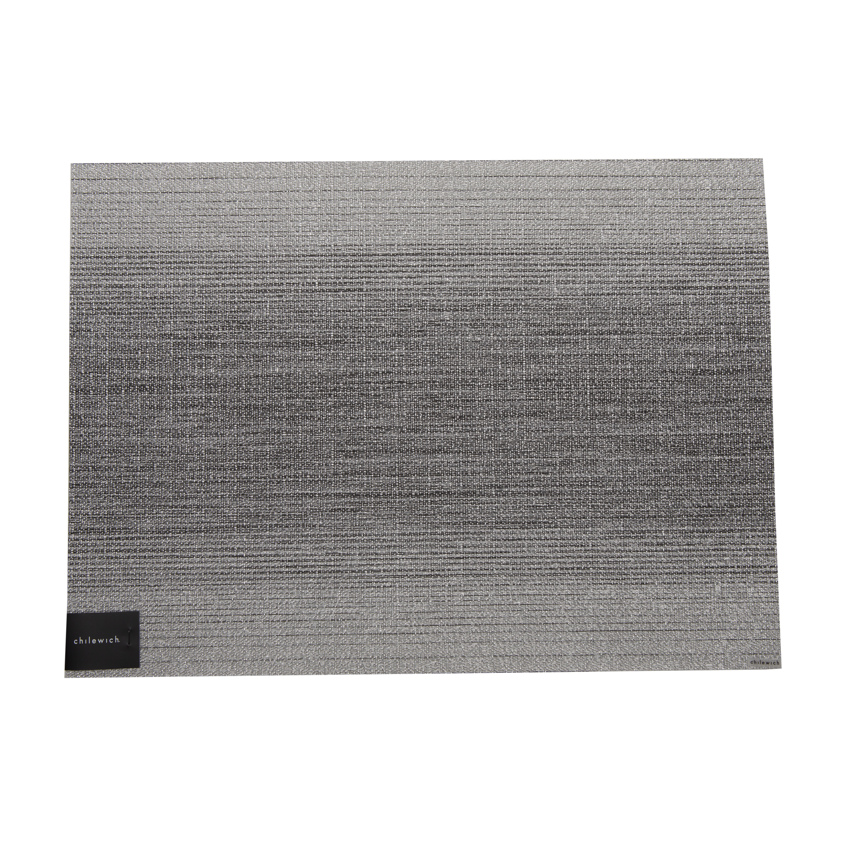 The placemat has a textured weave featuring a unique rotation of Chilewich's signature bi-color yarns to create a subtle ombré effect in the warp.