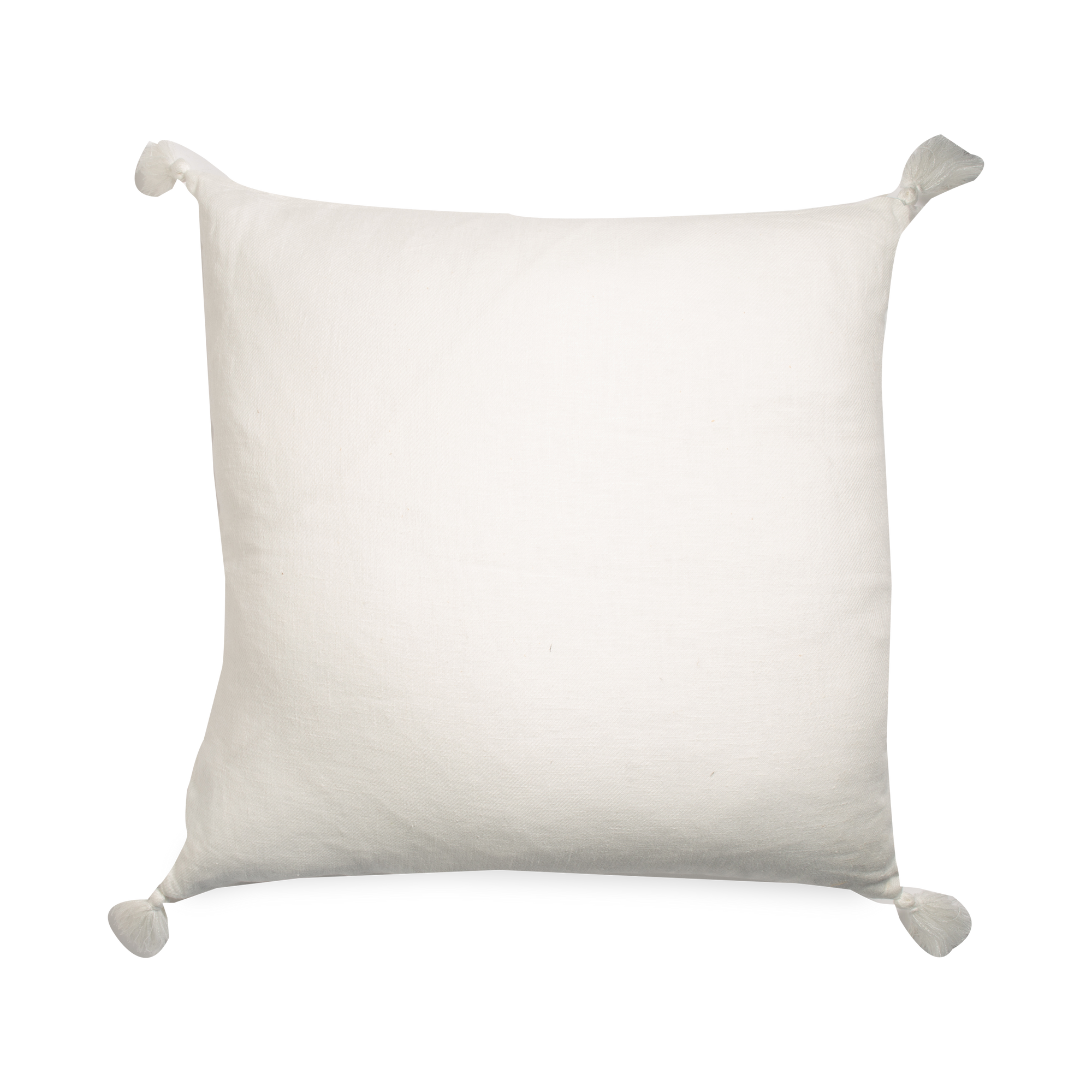 This pillow features a stone-washed linen cover in white with a tassel in each corner.