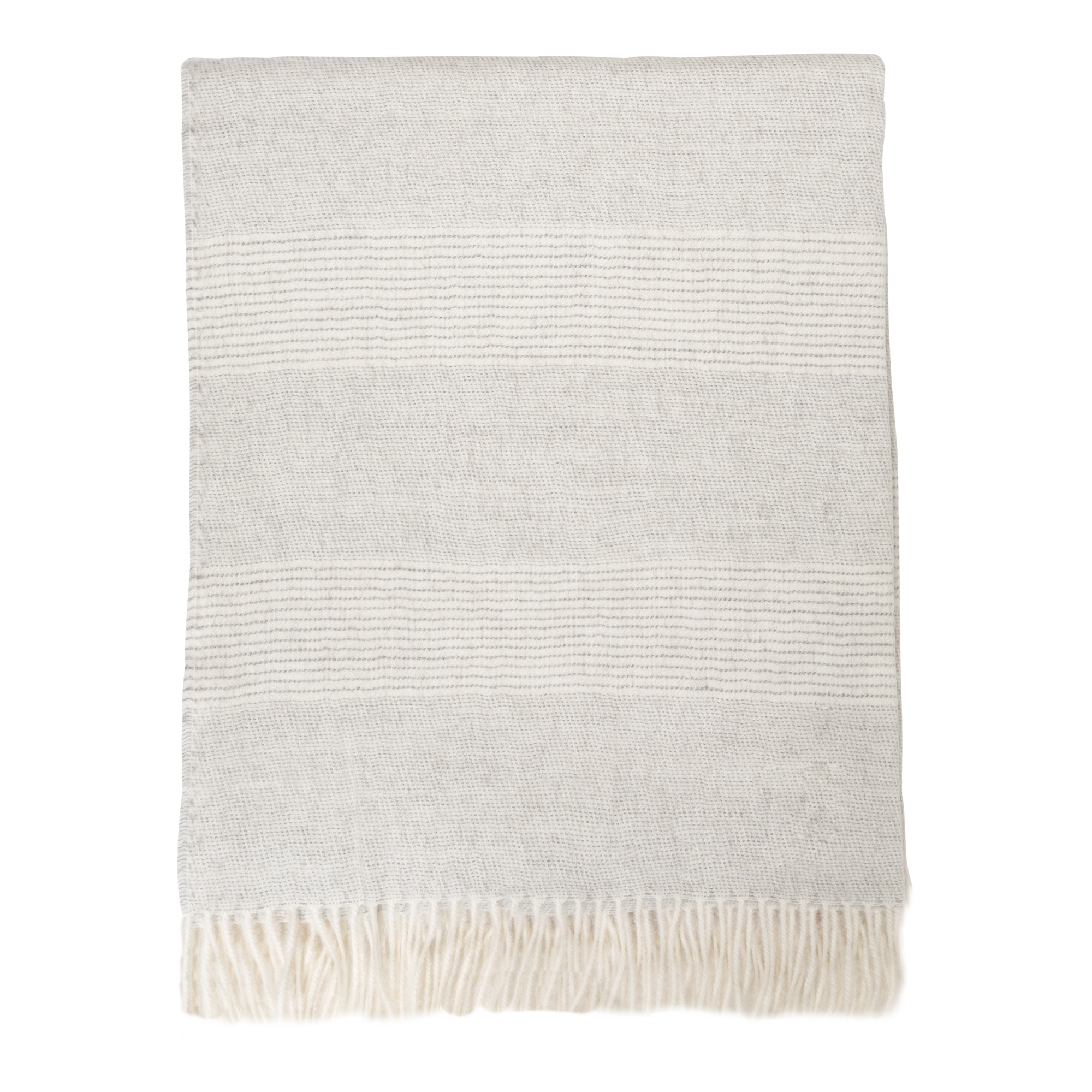 The soft and light texture of the Baby Alpaca Throw adds a touch of luxury to any room.