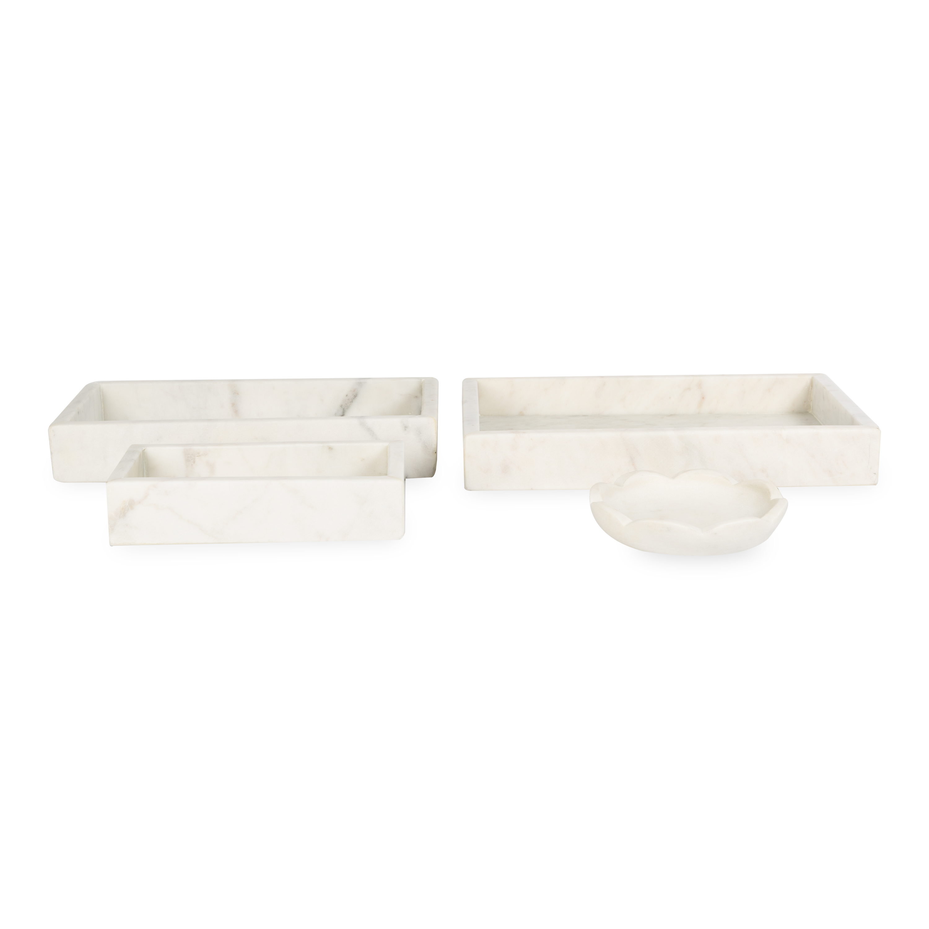 A collection of solid marble countertop pieces with a matte finish.
