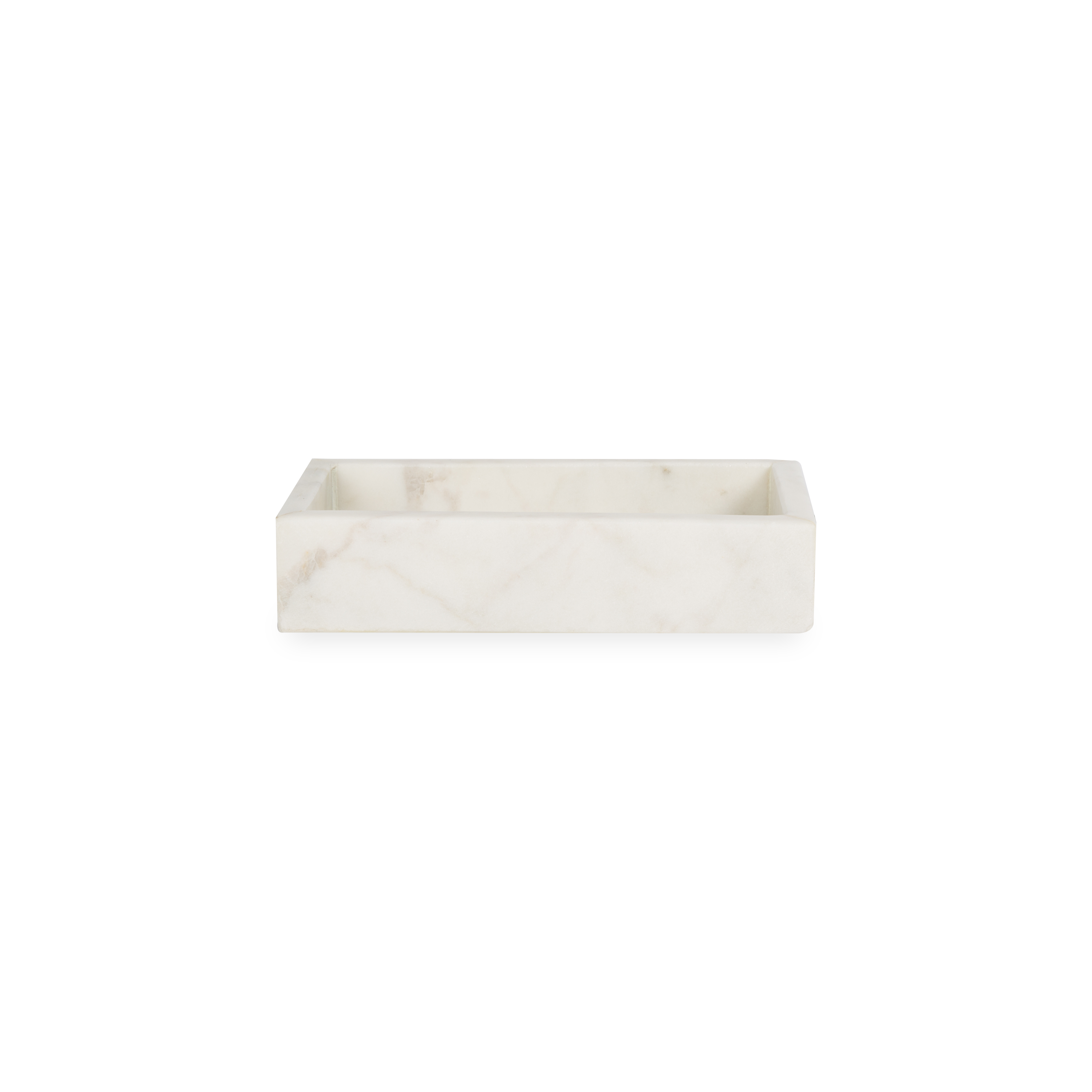 A collection of solid marble countertop pieces with a matte finish.