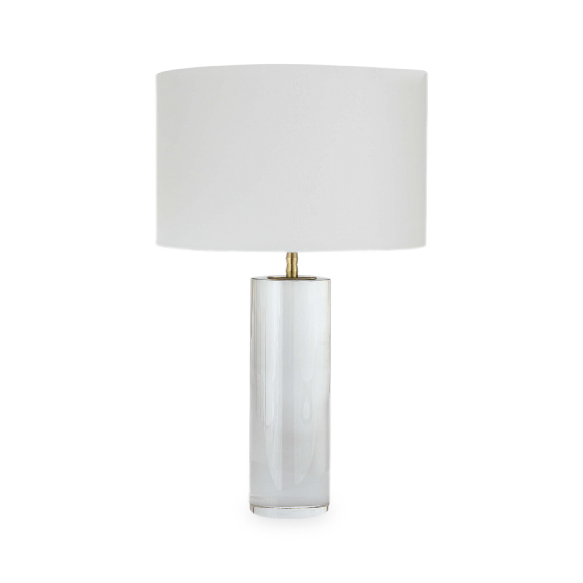 This solid crystal cylinder lamp base features a sleek silhouette and uniquely designed natural brass neck.